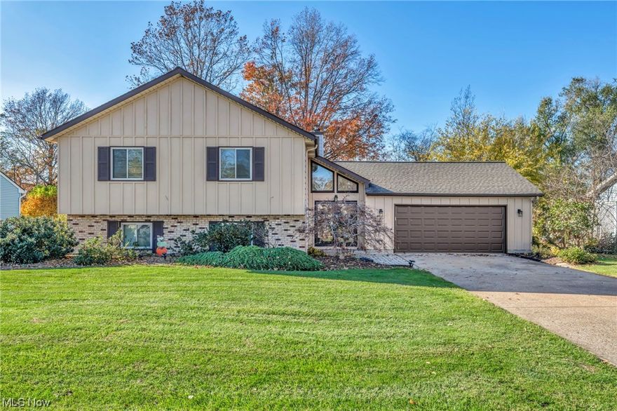 Spacious & Dramatic 4/5 bedroom, 2 full, 2 custom fireplaces, huge/light filled rooms, attached oversized 2 car plus garage while being situated in one of the most desirable neighborhoods just steps from Lake Erie w/3 acre lakefront association park (prime location)...Estate sale ready for fast occupancy! This home has been loved by the current owner & updated w/newer: dimensional roof (2014), H20 tank (2017), HVAC system (2010), vinyl windows (2010), garage door, exterior doors (2015), fresh exterior paint & more. Desirable treed lot w/raised deck for great views & patio for entertaining. Newer custom cherry kitchen open up to the formal dining w/premium corian countertops (cool design w/tiered breakfast bars added & built in appliances included. Grand foyer w/vaulted ceilings & exciting double door entrance. Well thought out floor plan w/massive rooms...2nd floor includes tons of natural light/views w/2 large bedrooms, full bath, kitchen w/dining & great room w/warming fireplace. Lower level includes 2/3 bedrooms (1 is set up as a large den w/double pocket doors), full bath, family rm w/full wall brick fireplace & private laundry room w/workspace. Approx 2600 sq feet of living space w/good division for privacy. Hard line gas grill. Desirable location w/easy access to highway, shopping, restaurants. Call today for your personal tour...