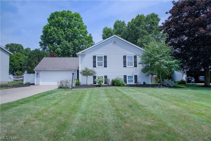 Beautiful split-level home located in North Canton CSD has so much to offer. This family-friendly home has over 1,700 sq ft of living space with updates throughout. Welcomed by the great room that features an abundance of natural light and sliding glass doors to the oversized deck great for entertaining friends & family. The private backyard is perfect for enjoying this warm Summer weather. The open-concept great room leads to the dining room and kitchen. The kitchen has cabinets galore, a dishwasher, and a large pantry. Completing the main level are 3 bright bedrooms and 2 full baths. The master suite includes a walk-in closet and an updated private bath featuring a large vanity. Located on the lower level is a cozy family room with a gas fireplace, a laundry room, a spacious office, and a recreational room with built-in storage. An attached 2-car garage finishes the package. Easy access to the airport, freeway, and shopping. Updates include paint and new carpet in 3 bedrooms, 2 full