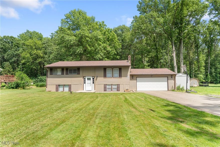 Welcome to 5511 Donner Dr., Clinton, OH 44216 – Your Next Chapter Starts Here! This spacious and beautifully maintained 4-bedroom, 2-bathroom bi-level home in Manchester Local School District offers 2,351 square feet of thoughtful design, convenience, and STORAGE galore – all for just $259,900!

Step inside and head to the main floor where you're greeted by a bright and updated kitchen, complete with a central island, gorgeous countertops, and modern cabinetry that makes both cooking and entertaining a delight. Directly across, the inviting living room is the perfect spot to relax or connect with loved ones.

Love the outdoors? You’ll adore the deck off the kitchen, overlooking a generously sized backyard with mature trees that provide both beauty and privacy. And for even more outdoor fun, Portage Lakes State Park is just a short drive away—perfect for boating, hiking, fishing, and year-round recreation!

Down the hall, you’ll find three spacious bedrooms and a full bath on the main level. The lower level adds even more space with a 4th bedroom featuring a walk-in closet, a bonus room, and a cozy family room with a stylish fireplace (seller has not used the fireplace and recommends a professional inspection before use).

The 2+ car garage is ideal for storage or projects and conveniently leads to both the lower level and the backyard via a man door.

This home truly has room for everyone and everything—and it’s ready for YOU! Don’t wait—schedule your private showing of 5511 Donner Dr. today and fall in love with where you live!

Washer and dryer do not convey. Assessments: Muskingum Watershed ($2 annual). Fireplace has not been used, have chimney sweep service before use.  Offer is contingent on seller closing on next property. OFFER DEADLINE: MONDAY JUNE 30, 2025 AT 8:00PM.