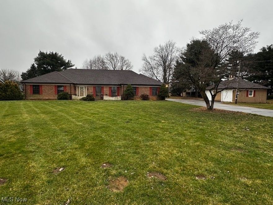 Come see this spacious 4-bedroom, 2.5-bath brick and vinyl ranch in Sandusky, Ohio! The home features a large family room with a fireplace, a generous eat-in kitchen, and a primary bedroom with a full bath and walk-in closet.

This property offers outstanding garage and storage space with an attached 2-car garage, an additional 2-car garage, and a separate outbuilding—perfect for vehicles, equipment, or a workshop. Situated on just over 2 acres, the home provides plenty of room to spread out while remaining conveniently close to town.

Recent updates include a new electrical panel and new carpet throughout. The large basement offers excellent storage and great potential for future finishing. A fantastic opportunity for buyers seeking space, versatility, and value—schedule your showing today!