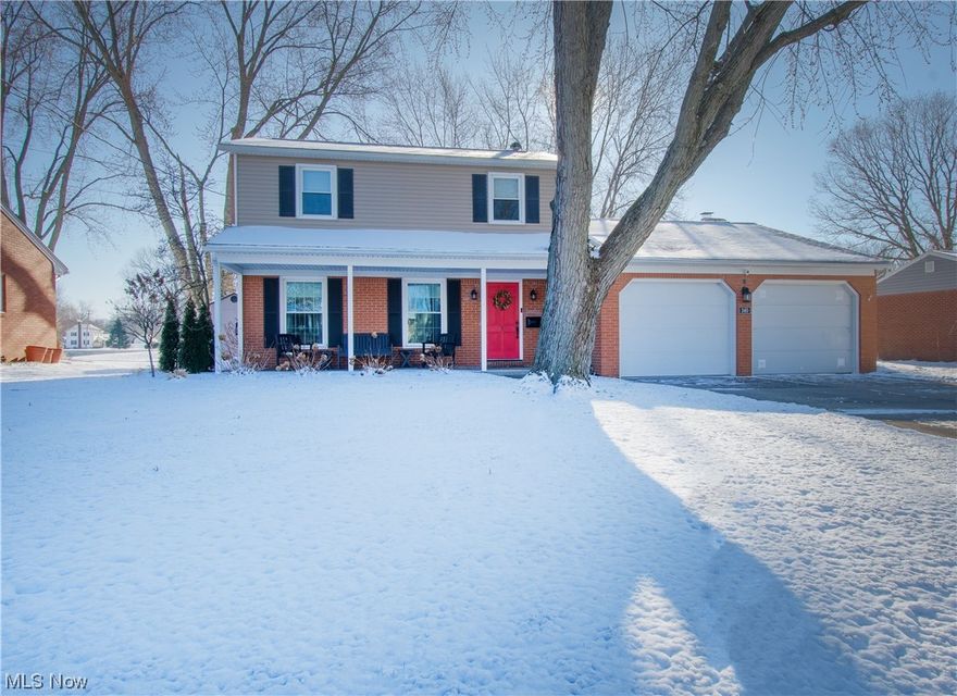 This charming well-cared two-story colonial is located in an established North Canton neighborhood. A fantastic layout flows throughout this home, perfect for entertaining family & friends. The inviting front porch welcomes you; as you enter, the great room is to the left of the foyer, which is bright, spacious, and open to the dining area. The beautifully updated eat-in kitchen offers stainless appliances, white cabinets, subway tile, solid counters, pendant lighting, laminate flooring, an island with seating for four, and flows to the open dining area. The family room has a cozy gas fireplace and access to the brick paver patio and backyard. A convenient 1/2 bath is between the kitchen and the family room, and easy access from the two-car garage. Upstairs are three bedrooms, an updated full bathroom with double sinks, a culture marble countertop, a great-looking walk-in shower, a linen closet, and a convenient laundry chute. The basement could be easily transformed into a living spac