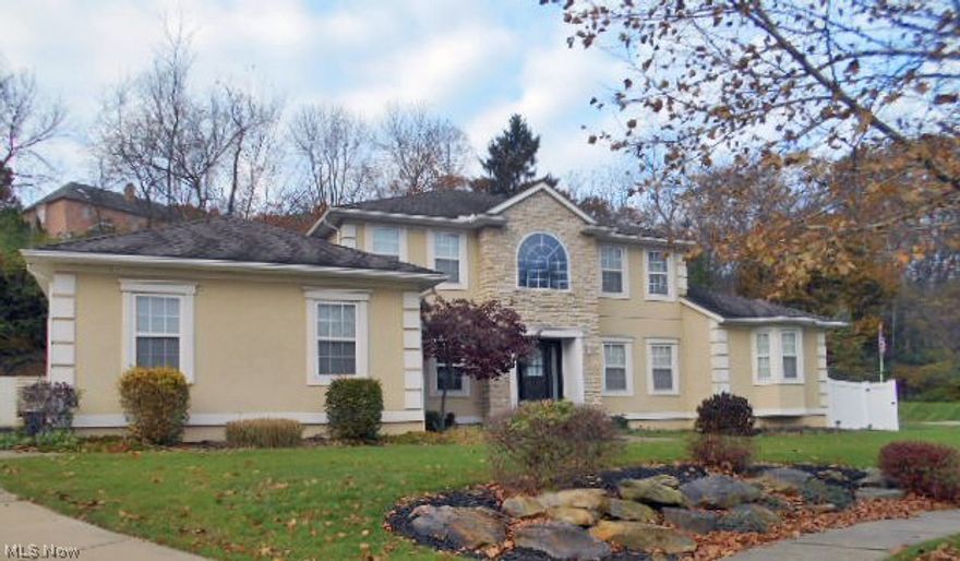 Spacious home in the desirable Riverwoods community with privacy, direct access to the Towpath Trail, and at the end of a cul-de-sac on a quite street. Walk into this open center hall home and find your upscale-comfort-casual. Open floorplan offers a custom kitchen with granite counters, eat in area and vaulted two story ceilings in family room offer plenty of outdoor light. Formal dining room with bamboo floors and a trayed ceiling accent. The first floor also offers the large master bedroom with direct access to the deck, roomy walk in closet and en-suite bath, as well as first floor laundry, a remarkable pantry, office or bonus room and a half bath. Three spacious bedrooms are upstairs along with a dual sinked bath. The bonus space is downstairs with an additional bedroom with en-suite bath, workout room, half bath, and grand recreation room with dry bar and built in entertainment area. Basement also has a second set of stairs leading out to the garage for direct entry without needing to enter the main house. Fenced in yard with a custom stone wall, pool with an automatic cover and solar heating system and hot tub complete the private outdoor space. This is a home is waiting for you, come discover it.