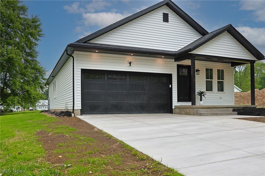 This just-finished new build in Marshallville is ready to impress. It's part of a growing neighborhood of new homes, but unlike a cookie-cutter development built by one builder, each home here has its own character. This one stands out with a bold black and white exterior and clean, modern finishes throughout.

Inside, you'll find 3 bedrooms, 2 full baths, and 1,374 square feet of thoughtfully designed living space. The open layout flows from the kitchen to the living area, making everyday life and entertaining easy. The primary suite includes a beautifully tiled walk-in shower that adds a touch of luxury. First-floor laundry adds convenience, and the full basement offers room to grow, ideal for a gym, rec room, or extra living space.

Located in the Green LSD school district in Wayne County, this home is perfect for anyone wanting stylish one-floor living with future potential. Homes like this don't last. Schedule your showing today.