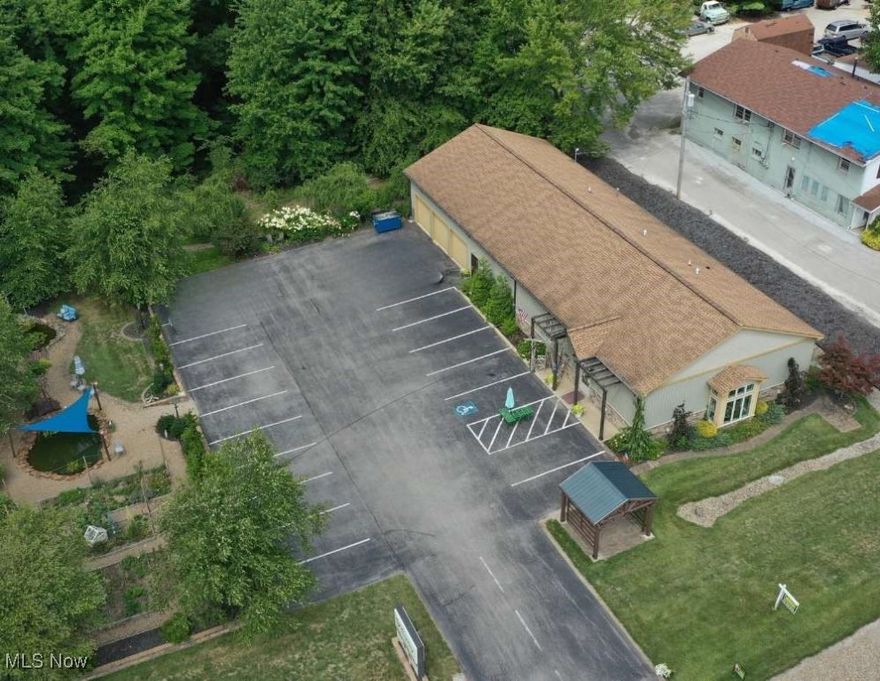 Commercial building with 6 acres of land to expand!  Excellent opportunity to own a well-maintained 4,400 sq. ft. commercial building built in 2014, situated on 6 acres, offering ample space for future development or business expansion. The property features paved parking, beautifully landscaped gardens with a large water feature providing a welcoming setting for customers and clients. The interior offers a spacious retail area, currently utilized as a floral and décor retail business.  This flexible space is suitable for a variety of commercial uses. The building layout accommodates both display and work areas that include a storage warehouse with overhead doors for deliveries-- making it ideal for retail, office, or mixed-use operations. This building is move-in ready, offers excellent visibility, modern construction, and abundant potential for future growth. Conveniently positioned just minutes from I-90, offering excellent accessibility for customers and deliveries. The opportunities are endless: Home décor, boutique clothing or gift shop, garden center or nursery (especially with the 6 acre & pond/garden setting), antique or consignment store, farm market or local artisan shop, winery, brewery, or tasting room with elegant outdoor space, Café or coffee shop with outdoor seating, Farm-to-table restaurant or bakery, event catering venue, Specialty food market or deli, photography studio, yoga & wellness retreat center, spa, salon or fitness studio, real estate, insurance, or professional office space, pet grooming or boutique store, there are so many possibilities! Take a tour today and discover the perfect setting for your next business venture.