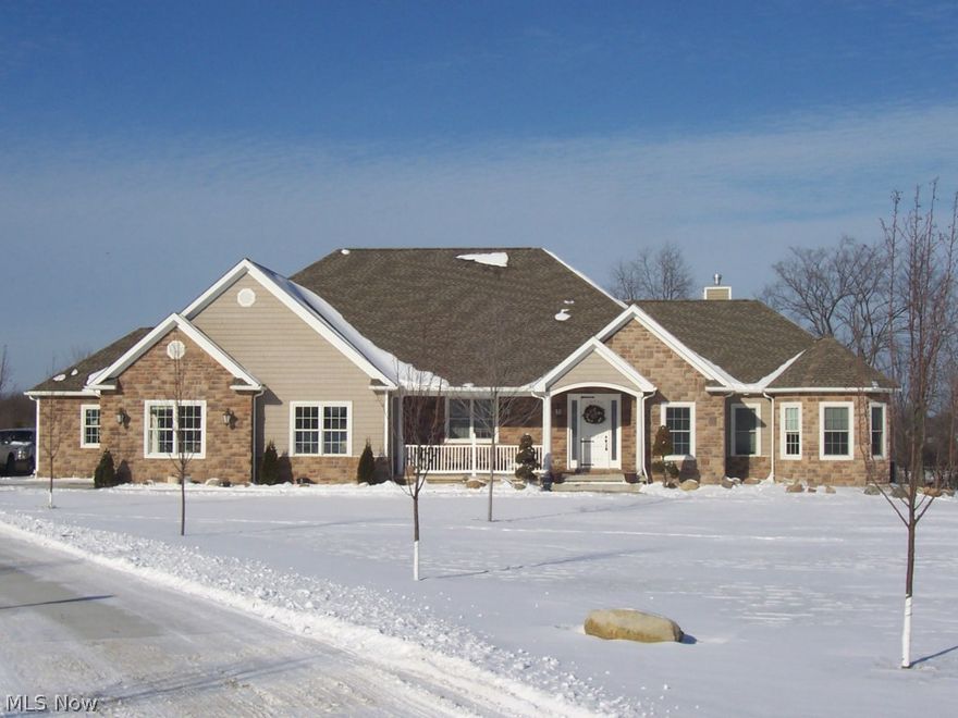 Looking for superb quality construction? Owners have been building this distinguished ranch with the utmost quality materials. Gourmet kitchen has custom birch and mahogany cabinets, built-in spice racks, walk-in pantry, golden paradise granite, Travertine tile and a breakfast bar that can seat six. Spacious master bedroom has a fireplace, hardwood floor and Brazilian cherry glazed baseboards. Master bath has heated Italian tile floor, jacuzzi tub and limestone counter tops. Shower is 6x8ft with 2 heads and 4 jets. Unique water flow design in floor. A huge walk-in closet completes the suite. Garages have higher ceilings and direct basement access. Great room has birch built-ins and gas fireplace. Two additional bedrooms share a Jack and Jill bath. Basement has 6 inch slab, two electric panels and 13 course height. Lennox heat pump with AprilAire and 3-zone heating. Plumbed for 2 additional baths. Come see the quality!