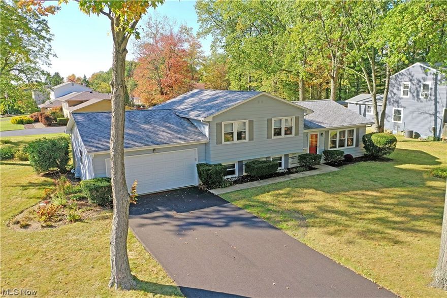 Stunning with three floors of move in ready living space, this attractive Cortland split level checks all the right boxes! Sat on a prominent, tree lined lot in a quiet development, this residence puts you close to local schools, libraries and attractions alike. The fresh blacktop drive leads you to a concrete pathway to the front door, while around back the impressive patio space enjoys partially fenced in privacy.  Through the front door, a welcoming living room opens with lush cream carpets and natural light spilling in from both the forward picture windows and nearby dining area. Here, dine in the warm of the midday sun while taking in the scenic views. A robust kitchen is just steps away with its host of wood faced cabinetry. Upstairs, a trio of remarkable bedrooms bring a mix of carpeted and hardwood flooring. The master includes private access to the immersive full bath that completes the floor. At the lower level, an expansive family room showcases rich wood trim work. Across the hall, a brightly colored half bath is located before the corner laundry and utility room.One year home warranty included
