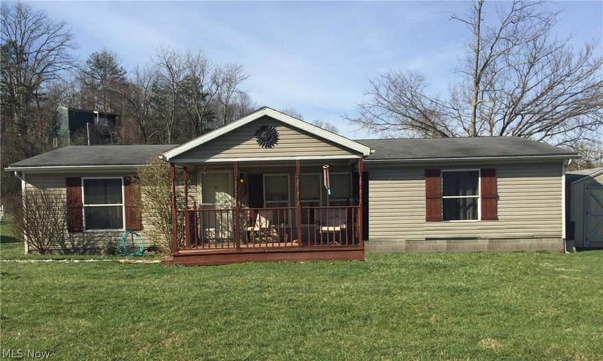 Enjoy country living in this 3 bedroom, 2 bathroom all electric manufactured home on a permanent foundation. Only 10 minutes from town, you'll love the updated kitchen and open concept. Storage galore in walk- in bedroom closets. A large front porch welcomes you to this lovely home. Storage building included.