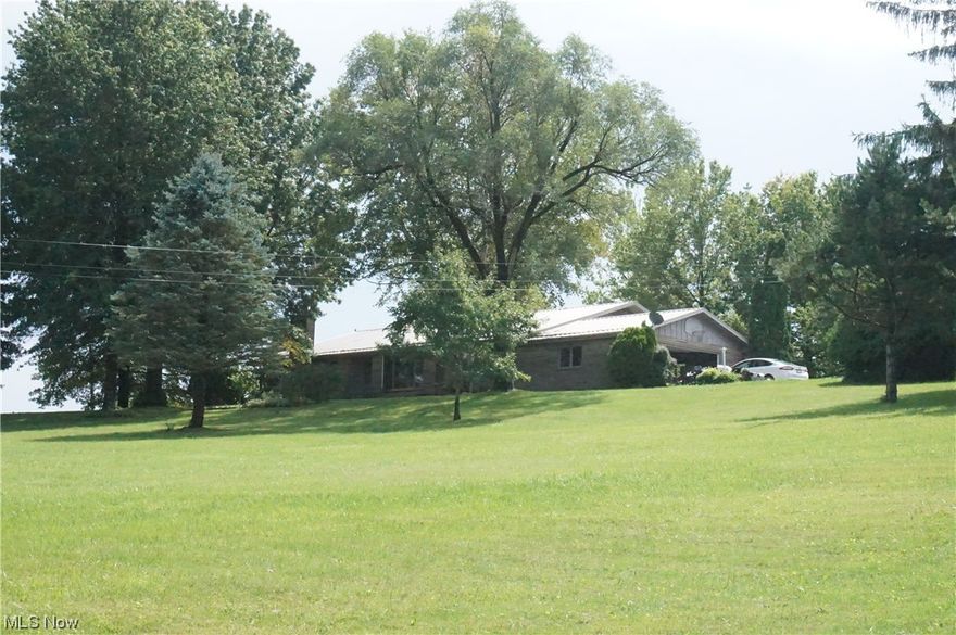 An Exceptional Investment Opportunity for Investors and Homebuyers Alike. Nestled within the captivating landscape of Holmes County, this remarkable property presents for both astute investors and those seeking their dream home. Encompassing 26.5 acres of prime real estate, the property boasts features that combine commercial potential with serene residential charm. At the heart of this offering is an expansive 3,200 square foot residence with a basement apartment. Furthermore, the property comprises six apartment units with attractive rental returns. The property also has a sizable 7-bay garage and a spacious 30’ x 114’ shop that has capacity to accommodate various commercial ventures. The property also has a picturesque backdrop, offering an awe-inspiring view of an expansive 8-acre field and 12 acres wooded. Strategically situated, the property's location enhances its appeal, providing a dual-purpose setting that can flourish as a thriving business frontage while maintaining its charm as a captivating residential enclave. The commercial viability and scenic serenity creates a unique proposition that caters to a diverse range of aspirations.