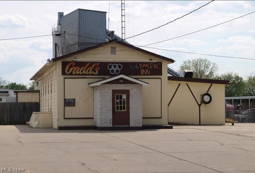 The perfect property for many uses; bar, restaurant, private club, etc. Plenty of parking. Two deep fryers, one flat grill, ice making machine, 3 bay stainless sink, microwave, one stainless steel prep table, one walk-in cooler (condenser new). Central air 2008, roof 2002, furnace 2008. Private & public restrooms. High traffic location & close to downtown.