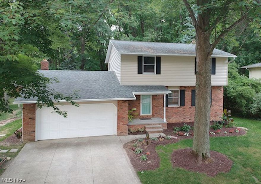 Beautifully updated Mentor colonial with 4 bedrooms and 1 ½ baths. This beauty is located on one of the largest lots on the street. The large living room leads to the spacious dining room and eat in kitchen. In the kitchen you will find new soft close cabinets, tiled back splash, and new kitchen island with granite counter top. Off the kitchen you will find a bonus room with a wood burning fireplace. The perfect place to relax and enjoy the view of the deep wooded backyard. All four bedrooms are located upstairs as well as the sleek and stylish updated master bath with granite counter tops and double sink in the basement you will find a bonus large stall shower next to the double utility sink. Don't miss out on this gem. Schedule your showings today.