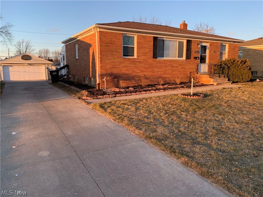 All appliances will be staying in this clean well-kept brick home which is right by Tri-C West College. Beautiful original hardwood floors, updated main bath including cabinet, tile, and fixtures. Electric service line has been updated and relocated underground. Entertain guests downstairs when you see the large open area that can easily be a family room, recreation room, or TV gathering area. Downstairs also boasts a full kitchen with appliances and sink area. There's also a workshop area too! This home features a four season room that walks out to your back yard. Full security system.