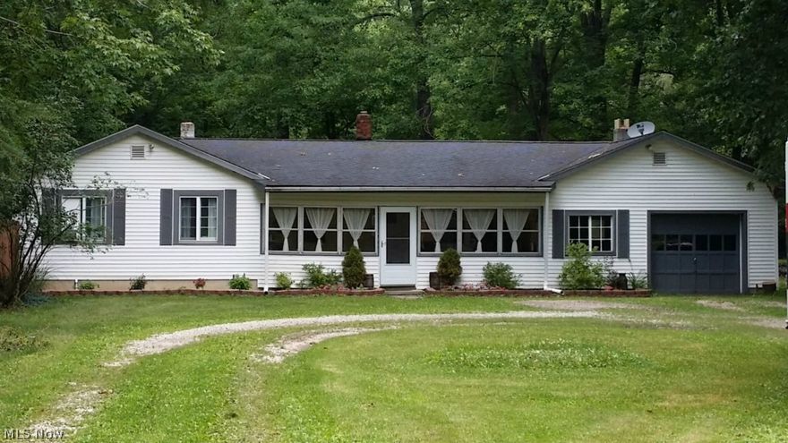 Charming Willoughby Ranch on Private 2+ Acres! Updated kitchen with newer cabinets, plenty of storage, built-in wine rack, ceramic flooring & breakfast bar. All appliances stay! Dining room w/ hardwood floors! Supersized 20x16 great room with vaulted ceilings & slider to deck! Updated bath! Nicely decorated throughout! Currently a 2 bedroom. Seller will return to original 3 bedroom, if requested! Relax on the 20x17 deck overlooking the wooded yard! Enjoy the enclosed 24x10 3-season porch! 1+ car attached garage w/ lots of storage above! Shed w/ electricity! New Laundry Rm 2015! Hot water tank 2013, sump pump, waterproofing & drainage 2014, updated electrical & plumbing! Set back off the street! Quick freeway access! Minutes to popular Chagrin River Park & Historic Downtown Willoughby!
