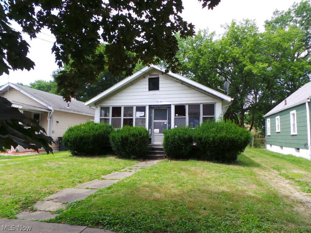 This home features 2 bedrooms, formal dining room , plus eat-in kitchen, living room with fire place, Enclosed front and back porch, full basement, hard wood floor under carpet, garage plus deep fenced-in lot! Property sold AS IS. Property available thru online bidding only. Online bidding starts 10/6/18 ends 10/8/18.
