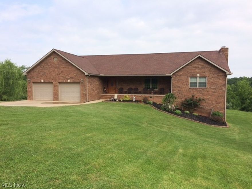 Poured foundation, huge walk-out basement potential, great room with large living room area, dining room area, gourmet kitchen with lots of counter space, laundry/mudroom off great room, large deck with beautiful views about 4 AC mowed, covered front porch, outbuilding