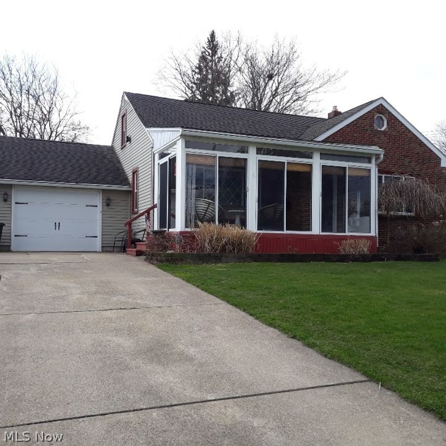 Extremely well cared for charming 3 bedroom, 1.5 bath home.
Numerous updates include a remodeled kitchen with stainless steel appliances, flooring, countertops, stone backsplash, fnew ixtures and expresso cabinets.  The living room features refinished hardwood flooring, large windows and a lovely entry door which leads to an enclosed 3 season patio room adding extra living space to the home.  Updated baths including a new shower wall with a glass block window.  New garage door.  The spacious second floor features a sitting room at the top of the stairs with a spacious cedar closet.  This space could also be a play room, office or sewing room.  In the rear is a huge bedroom with a half bath, a large wall closet, builtin wall dresser and a very large storage closet.  The fenced back yard with a paver patio is covered by a new gazebo.  This home will go fast!