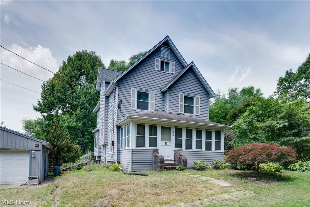 More then meets the eye in this beautiful historic colonial! Stunning woodwork throughout the entire home, hardwood floors under all carpet, oversized 2 car garage, large enclosed patio, and tons of storage! Kitchen has plenty of cabinetry that has been updated with separate storage/pantry room and open to formal dining room. Solid hardwood doors throughtout all levels. Second level features 2 full baths with primary having their own private bath and walk-in closet. Upper attic is finished and can be additional living space or office that includes air and heat. Garden shed, greenhouse, two tiered deck and huge 12x24 storage shed off the back of the property! Home Warranty provided! Schedule your private showing today!