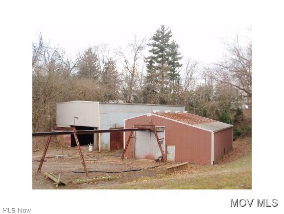 Mobile Home & 2 Commerical Buildings. 2007 Clayton mobile home, immaculate, spacious living room w/cathedral ceiling, large kitchen w/lots of cabinetry & island, dining room, master bedroom has bath w/barden tub, shower, double vanity. Large covered deck, storage building & 20 x 20 detatched garage. Once building is 78 x 40(wide) w/27 foot high ceiling, crane rails, concrete floor & steel walls. Other building is 62 x 46(wide) w/17 foot high ceiling pole building construction w/concrete floor. Both buildings have 200AMP & one has half bath. Seperate entrance for commercial buildings. Fire: VOL Police: SHF WaterAvail: Y GasAvail: N