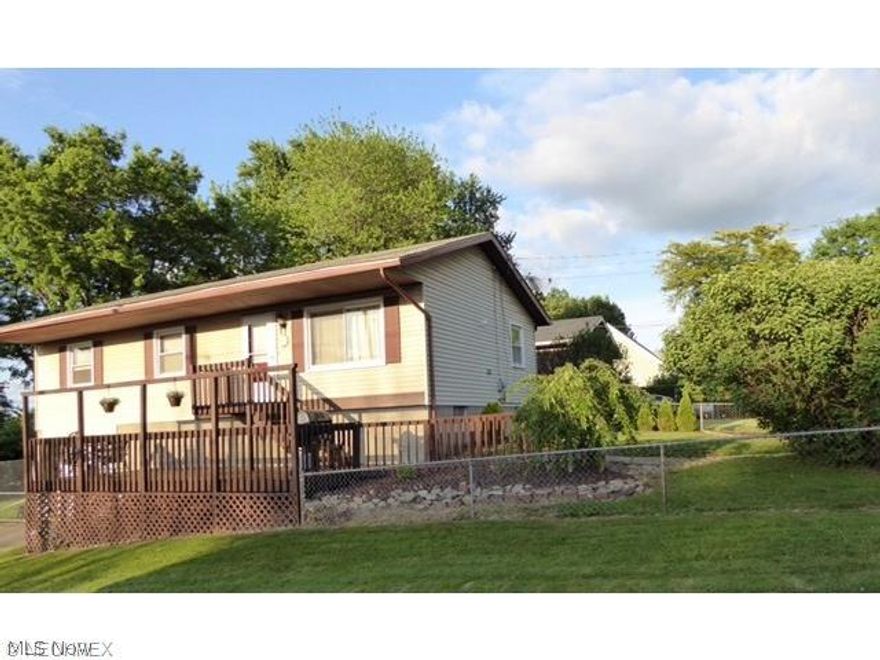 Just move in! Quaint raised ranch with a newly remodeled kitchen and bathroom. Entire yard is fenced. Nice deck on the front of the house for entertaining. Retaining wall was rebuilt and a new furnace added in 2010. The water heater was installed in 2009. Newer carpet in the second bedroom in 2015. Large, clean basement can be finished or used for storage. Convenient to the hospital, shopping, highways, and restaurants. Home warranty provided by the seller. Call for your personal showing today!