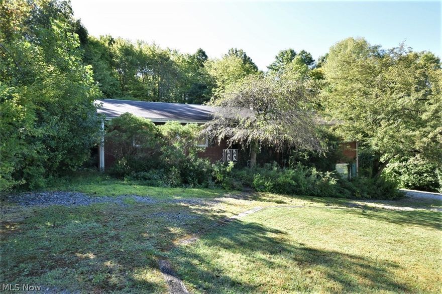 Fantastic opportunity in this sought after subdivision off of 87 near the metro parks! An all brick 4 bedroom mid century ranch with 2 full baths, 3 fireplaces, hardwood floors, beautiful beams in the kitchen/ family room combination with sliders to the deck & 2nd fireplace. There is also a walk out lower level recreation room with fireplace. The master has an en suite full bathroom and there is a large full bathroom in the hallway for the other 3 bedrooms. This is an estate that has overgrown landscaping & has not been updated yet has incredible potential and was cared for as well as could be. The seller of the estate will not complete any repairs nor have the septic inspected or repaired & is priced accordingly. The 2 car garage is under the main floor so you enter into the large Laundry area with lots of storage space as well. This is a rare find in a great neighborhood! West Geauga Schools.