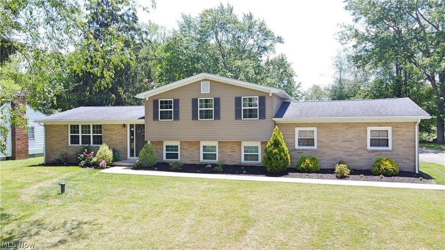 This Stunning Show stopper 4 level split HOME in Perry will knock your socks off! Looking for a large lot to host those family gatherings? This is it, just shy of an acre and backs up to beautiful woods! Peaceful and serene! You will appreciate the lush new landscaping in the front yard! As you enter thru the Front door you will see new carpet, a vaulted ceiling living room that opens to the dining and kitchen area.  New paint, flooring and cabinets.  No need to look any further as this home offers 3 large bedrooms upstairs, a spacious family room downstairs, with fireplace and a fourth bedroom or office with full bathroom! And a HUGE full basement!! Many recent updates include a new drilled well, new carpet, HWT, new landscaping around the walkways, painting, stained deck, trees trimmed in front yard, garage painted floor and ceiling! A/C was serviced, and new coil put in! This home will not last!