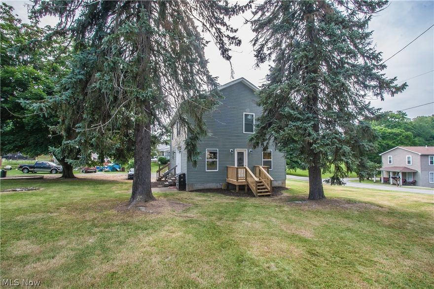 Welcome to one of the most spacious and move-in-ready homes in East Liverpool! This two story house has an awesome open 1st floor plan that allows the kitchen, dining, and living areas to all be within sight. The entire house has been well kept and upgraded/renovated in 2013 with tasteful colors and quality materials as well as convenient light and fan switches for customized control of the rooms' lighting and comfort. There are ample windows to provide natural light in every room, and desirable window treatments when privacy is needed. The kitchen is adorned with granite countertops, large format ceramic tile, and stainless trim & appliances. The interior doors are all solid wood, as is the newer 2nd floor staircase. The 2013 addition added 600sqft, including the master suite upstairs with large walk in closet and double vanity bathroom. The walk-out basement has a large double door leading outside from under a 26' x 10' wooden deck for outdoor entertaining or relaxation. Large trees