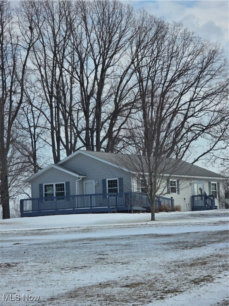 Welcome to this well-maintained, custom-built home offering peaceful country living just minutes from shopping, dining, and everyday conveniences. Built in 2008, this thoughtfully designed two-bedroom, two-full-bath home sits on 2 scenic acres with room to grow. Inside, you’ll find custom Merrilat cabinetry and light fixtures from Ashland's own Olde Parsonage, along with custom woodwork and window treatments. The home features Simonton tilt-in windows with added gas in the panes for enhanced energy efficiency, temperature control, and UV protection. The layout is both practical and comfortable, with plumbing kept to concise areas and easy access through bathroom closets for maintenance. The primary suite includes a full bath with shower, while a second full bath with shower is centrally located. The great room, bedrooms, and laundry room feature new flooring, along with new paint. A propane fireplace with two 100-lb propane tanks adds warmth and ambiance, and there’s an electric outlet above the fireplace for easy TV mounting. You’ll also appreciate the whole-house surge protector and ample electrical outlets throughout. The home is all electric. The heat pump and furnace were serviced in July of 2025. The full walk-out basement features 13-course block walls, a sump pump, shelving for storage, and outdoor access. Also included are a riding lawn mower and two push mowers, making maintenance a breeze. The roof was installed in Fall 2009, and the home is equipped with a Vector Security system (subscription required). Enjoy tranquil views, open space, and even the occasional hot air balloon sighting, all while being just minutes from stores and restaurants.