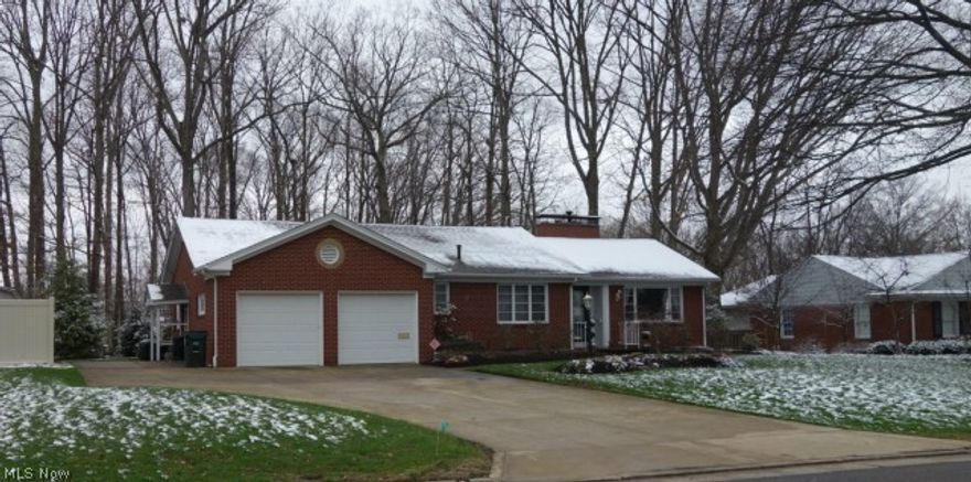 Hidden treasure in prime North Canton location.  Meticulously maintained and up to date.  Charming brick ranch with large backyard.  Formal living room offers a wonderful place to gather and is adorn with a gas fireplace.  Warm hardwood flooring flows throughout the hallway, the kitchen and the formal dining room.  The kitchen eat-in kitchen is sure to impress with beautiful cabinetry and hard surface counter tops.  First floor master bedroom is a nice size and has a convenient first floor laundry and wall ironing board right around the corner.  The lower level offers more space and a an extra bath.  Come inside and discover all this solid, well built, brick home has to offer.