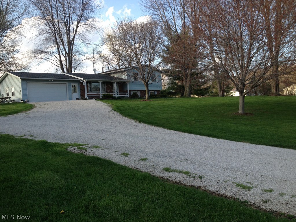 This home is on a beautiful 5 acre farm with a spectacular lake view. 2 barns on property. Your own paradise. There is 220 power and water in the new barn. Also has a new car lift. The 130 yr old bank barn is in Great shape! Property is subject to survey. This can also be purchased with the 51 acres.