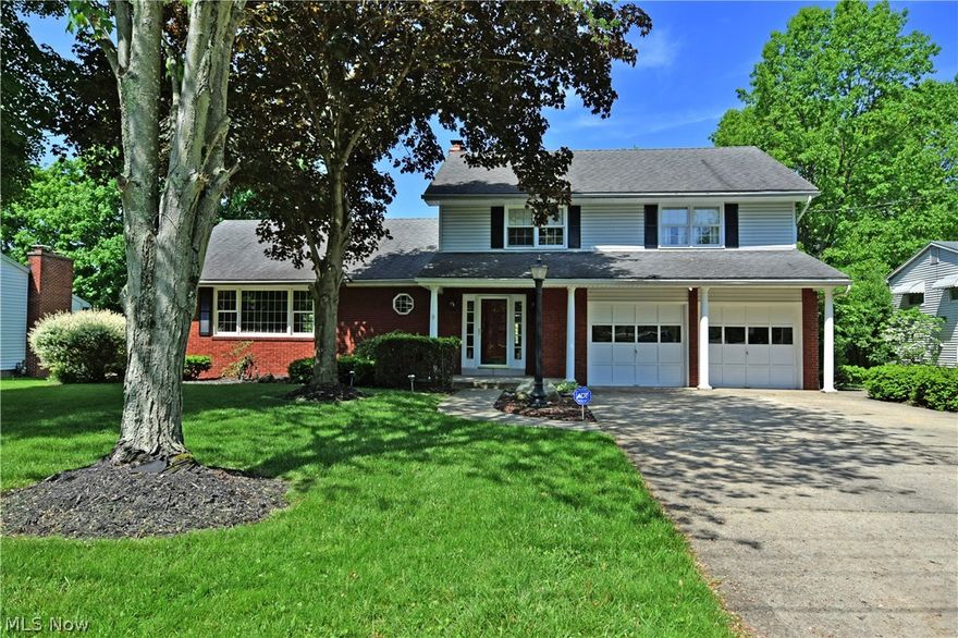 Do you have a growing family? Need big room, fun summer activities and places to entertain? Look no further! This beautiful two-story home has everything you are looking for and more! Filled with rich, hardwood flooring; spacious living and dining areas are just steps away from the tiled foyer. Heavy wood panel and brick use compliment the family room along with an inset fireplace. The updated kitchen boasts a functional island with flat top cooking surfaces tucked into the Corian style countertops. Stainless and black appliances mix in, while a four-pane window gives a great view of the pool. Not just any pool, but a stunning in-ground private getaway, complete with bespoke storage, privacy fencing, a stepped entrance and a diving board! Take in the incredible views from inside an extravagant finished sunroom and bar area built off the back of the home. High polished tile flooring reflects light from the multitude of windows and French doors; truly a sight to see. Nearby, laundry service and a full bath make quick work of swim trunks and chlorine. Upstairs, three large bedrooms each provide comfortable living with more hardwood flooring and baseboard heating. A full bath separates the rooms at the main hall. The lavish master bedroom is complete with a changing area and private bath. Downstairs, a dark and moody additional great room reveals an inviting full bar, waiting just for you!