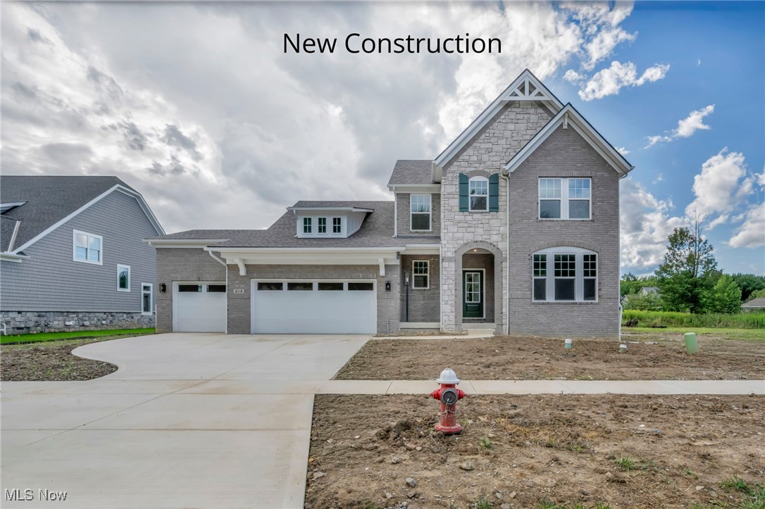 Move-In Ready! Experience luxury living on Hole 4 of the prestigious Red Tail Golf Club in this stunning Drees Homes new construction home located in the sought-after Red Tail community in Avon. 1st 2 years of membership included! This spacious residence offers 4 bedrooms and a 3-car garage, along with an impressive wraparound covered outdoor living space complete with a stone fireplace—perfect for entertaining or relaxing year-round. Inside, the main-level primary suite is your personal retreat, featuring a spa-like bathroom with an oversized shower and a generous walk-in closet. The open-concept layout includes a gourmet kitchen, inviting family room, and a dramatic two-story dining area, all designed to flow together seamlessly for effortless everyday living and entertaining. A private home office and family foyer for easy organization add function and style to the main floor. Upstairs, you'll find two additional bedrooms and a full bathroom, ideal for family or guests. The finished basement adds even more living space with a large rec room, 4th bedroom with a walk-in closet, and an additional full bath. Don't miss your chance to own this beautiful new home in one of Avon's premier golf course communities—schedule your tour today!