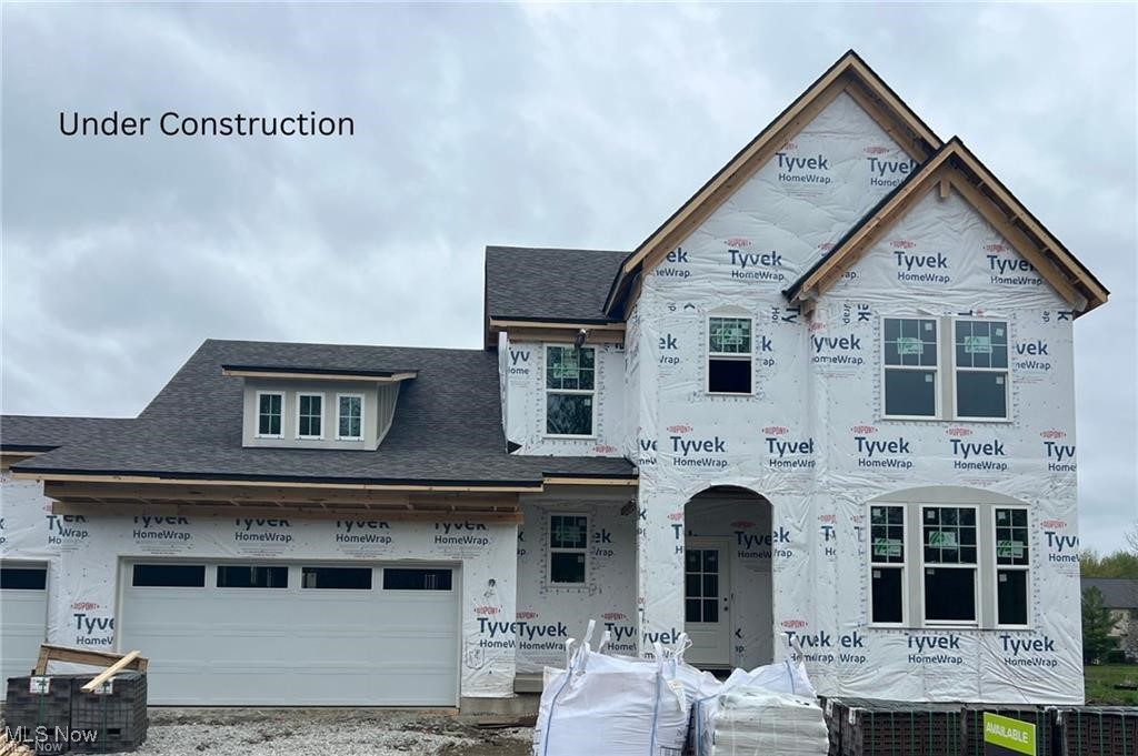 Move-In Ready by July 31st! Experience luxury living on Hole 4 of the prestigious Red Tail Golf Club in this stunning Drees Homes new construction home located in the sought-after Red Tail community in Avon. 1st 2 years of membership included! This spacious residence offers 4 bedrooms and a 3-car garage, along with an impressive wraparound covered outdoor living space complete with a stone fireplace—perfect for entertaining or relaxing year-round. Inside, the main-level primary suite is your personal retreat, featuring a spa-like bathroom with an oversized shower and a generous walk-in closet. The open-concept layout includes a gourmet kitchen, inviting family room, and a dramatic two-story dining area, all designed to flow together seamlessly for effortless everyday living and entertaining. A private home office and family foyer for easy organization add function and style to the main floor. Upstairs, you'll find two additional bedrooms and a full bathroom, ideal for family or guests. The finished basement adds even more living space with a large rec room, 4th bedroom with a walk-in closet, and an additional full bath. Don't miss your chance to own this beautiful new home in one of Avon's premier golf course communities—schedule your tour today!