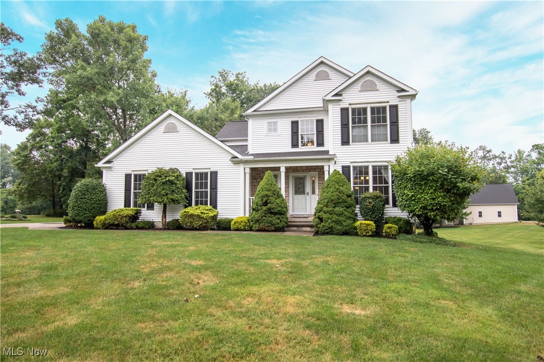 Welcome to this fully updated 4-bedroom, 3.5-bath home situated on a private 1.5-acre lot with a finished walk-out basement and a 2.5-car attached garage. From the moment you step into the 2-story foyer, you'll be impressed by the open and inviting layout. The spacious 2-story great room features a cozy fireplace and flows seamlessly into the eat-in kitchen, which boasts granite countertops, white cabinetry, stainless steel appliances, a breakfast bar, bay window, and sliding glass doors leading to the expansive 540 sq ft Trex deck. The main floor also includes a formal dining room, a convenient half bath, and a laundry room. The first-floor primary suite offers direct access to the back deck and includes a beautifully renovated (2020) en suite bath with dual sinks, a soaking tub, and a separate shower. Upstairs, you’ll find three additional bedrooms, a second full bath, and a cozy loft area that overlooks the great room—perfect for a reading nook, play space, or additional office area. Large closets are provided throughout the home, offering ample storage space. The finished walk-out lower level adds even more living area with a spacious rec room, third full bath, and sliding glass doors leading to a private patio—ideal for entertaining or relaxing. An unfinished portion of the basement provides excellent storage options. Notable updates include a new furnace with Aprilaire, air conditioner, and hot water tank in 2024, a renovation of the primary bathroom in 2020, and a new front door in 2018. This move-in-ready home combines thoughtful design, modern updates, and plenty of space both inside and out—ready for you to make it your own.