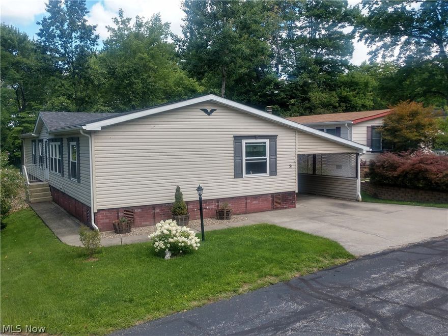 Wonderful, LARGE, move-in ready 3BR/2B home on cul-de-sac street in peaceful and inviting Troy Oaks community. Resides near LaDue Reservoir providing convenient fishing and recreational opportunities. This home has been well maintained, updated (more on that . . . ), and is VERY clean. Originally a model unit, the extra sq. ft. allows for a spacious and unique flowing layout that, buoyed by the brick inspired skirting, truly feels like a conventional ranch style home. Ceiling fans and skylights adorn throughout along with recently installed "smart" switches and areas of updated lighting. Beautiful kitchen with elegant mantle and look of rich oak, newer stainless steel appliances, island with dual-sided storage, bonus prep sink and lots of cupboards. Cozy family room with wood burning fireplace and pleasant, sirene view - no neighbors behind. Spacious bedrooms including master bath with dual sinks. Updates to this already newer 2006 home are significant and numerous including: roof/2021