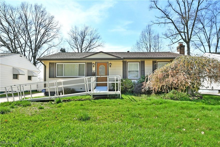 Potential packed with two floors of finished living space, this welcoming Warren ranch 
checks all the right boxes! Set within a quiet neighborhood along a low traffic side street, 
this home quickly stands out with its dark brown accents and the prominent aluminum 
ramp to the front door for easy mobility access if desired. A cement driveway continues 
back to find an impressive, three car garage for tons of storage space. The grassy side yard 
follows suit as the large cement pad doubles for turnaround and patio space. Inside, the 
well-kept surroundings begin with an attractive living room, filled with plush cream carpets 
and enjoying its large windows that spill natural light inside. Across the threshold, a 
spacious kitchen includes eat-in dining space over its tiled flooring. A faux brick 
backsplash pairs well with the naturally finished cabinetry. Down the main hall, a trio of 
inviting bedrooms are met with a brightly lit full bath and its updated shower. At the 
basement level, a finished family room brings wood panel walls and a substantial brick 
mantle with its inset fireplace. Opposite, provisions for a second full bath include a shower 
and standalone commode. Call today for your private showing!