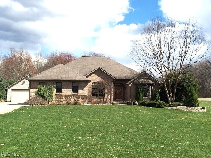 What an Awesome Custom Ranch on almost 1 Acre!   Nice open floor plan, Great room has 10' ceilings and a Gas Fireplace, Private Master Suite separate side of house with huge Bath and Walk-in Closet. Lovely Office with Bay Window, Formal Dining room, Kitchen with all Appliances, Pantry, and Eating Area leads out to an all year around Sun Room with Vaulted Ceilings,  a Black Wrought Iron and Aluminum Fence encloses the Yard and Brick Patio. There is a 2 Car Attached Garage PLUS a 1750 square foot Heated Detached Garage w/attached dog kennel.  Awesome Home !!!