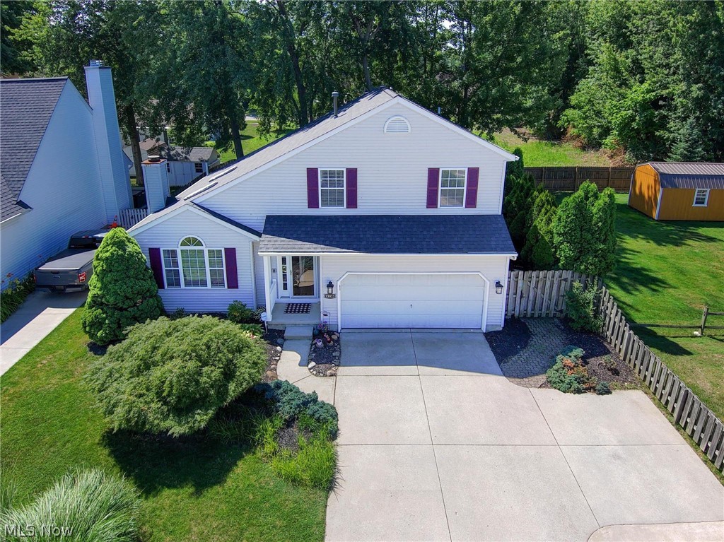 LAKE ERIE views & sunsets from your own front porch and living room! Avon Lake Schools! Very neat and clean Avon Lake 3 bedroom, 2 1/2 full bath home built in 1994 located very close to the public boat launch & fishing pier on Lake Road. Open floor plan w/2 story great room w/cathedral ceiling, 2 newer skylights, gas log fireplace & formal dining area. The fully applianced eat-in kitchen has newer quartz countertops, maple cabinets, tile flooring, big walk-in pantry, patio slider door to the private back yard & the 1st floor laundry room is close by. The 2nd floor features 3 bedrooms with the master bedroom having a vaulted ceiling, walk-in closet & it's own full newer bathroom w/dual sinks. The other 2 bedrooms have peeks of Lake Erie. The 2nd floor quest bathroom and the master bathroom were both remodeled in 2021. The almost full basement could be finished off for more additional square footage if so desired and has a sump pump w/battery back-up and large breaker box w/generator transfer switch. The fenced in back back yard is very private and has a large wooden deck and brick paver patio. Additional features are new furnace and new central air in 2020, new roof & new 2 skylights in 2018, leaf gutter guards, attached garage w/newer garage door opener, extra wide driveway, newer exterior lights and so much more on a 60x135 lot. Property is also located just over 1 mile away from the Avon Ford Plant w/easy access to route #90. See sellers feature sheet in supplements.