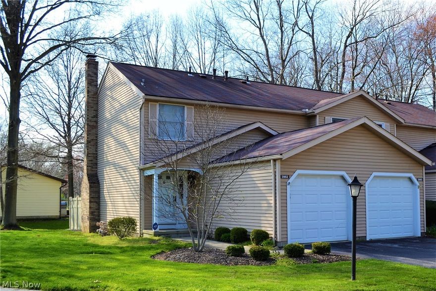 Gorgeous end-unit has been beautifully updated! New white kitchen with ceramic tile floor, solid surface countertops, stainless steel appliances, and glass tile backsplash! Living Room boasts laminate flooring and a woodburning fireplace with a slate surround. Sliding glass door opens to a private patio with a new vinyl privacy fence. Convenient powder room completes the main level. Updatirs, you will discover two large bedrooms with tons of closet space and the beautifully updated main bath with new tub, toilet, countertop, and ceramic tile floor! Fantastic finished lower level with a family room, updated half bath, and laundry! Immaculate and well-maintained! Hurry - this one won't last!