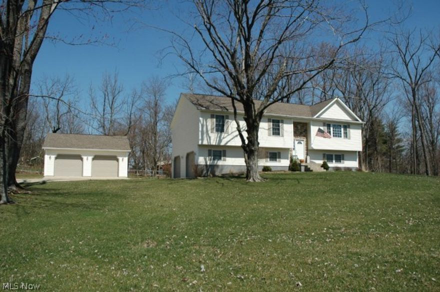 Beautiful home, move in condition.  Large corner lot in wooded subdivision.  Home offers two car attached garage /Extra 2 car detached garage
additional bedroom, family room, full bath great for teens or In-law suite in lower level