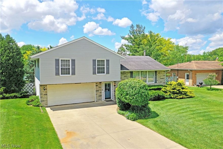 Get ready for your next adventure with this wonderful Champion residence, bringing plenty of outdoor excitement to your backyard! This four-bedroom home offers up three levels of finished living space within its expansive tiered layout. The brick accented façade and lush landscaping add to the curb appeal, but the real treat is around back in the privacy fenced yard. Starting with a relaxing sunroom, a nearby covered patio space overlooks the inground swimming pool with a huge concrete pad and playful slide. Joining them are a corner storage shed and tropical feeling water feature sat just off to the side. Back inside, a large foyer makes for a casual transition to both main and lower floors while a half bath waits nearby. The main floor enjoys a sizeable picture window, filling the carpeted room with natural light. Around the corner, the dining area besets sunroom access as the robust kitchen completes the level. Upstairs, four bedrooms include a master suite with full private bath. A second full bath brings the total to three. At the basement level, a finished rec room includes a gas chimenea, hidden laundry and shop space.