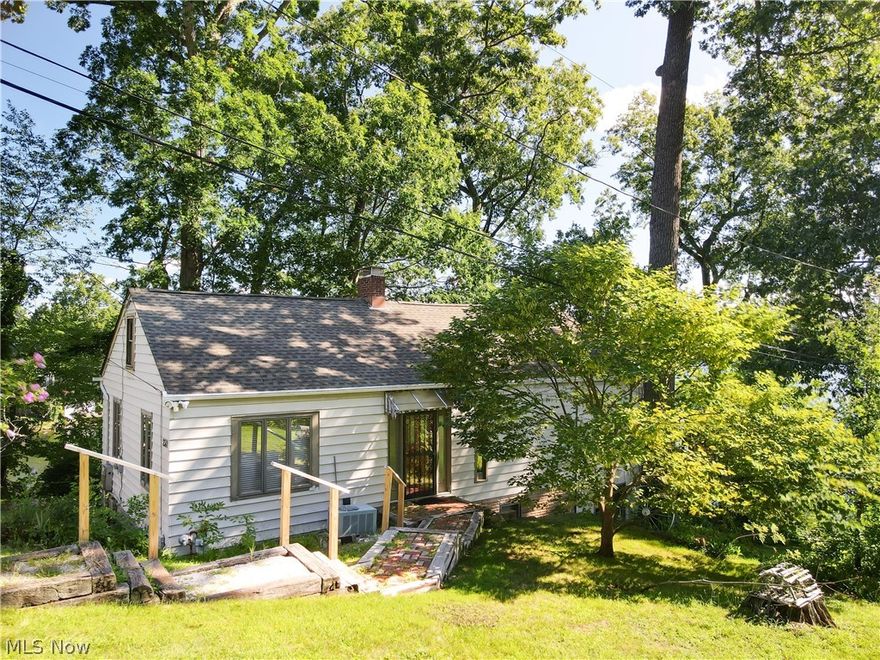 Best View on Portage Lakes!! This charming home features four boat slips, an amazing panoramic view, dead end street, large 2 car garage and so much protentional! This beautiful home has been well maintained by previous owners. Wrap around deck would be ideal for this home. Nice size bedrooms, two baths and storage. Secured lot with a ton of privacy and beautiful lake views.