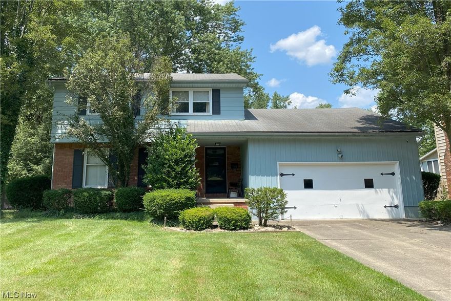 Looking for a spacious home in the heart of Boardman that has been meticulously maintained and has high-quality improvements? Look no further! Boasting over 2,100 square feet, 4 bedrooms and 2.5 baths, this home is in move-in condition, needing only your personal touches. On the main level, you can enjoy the convenience of a gas fireplace in the family room to warm you on cold winter days. And regardless of the season, you can step into the attached heated and cooled sunroom with loads of new windows for natural light and fresh air, all overlooking an over 200' deep back yard. This 2 story colonial features all the conveniences of first floor living if you so choose. A custom built first floor laundry has been added with stacked washer and dryer, a sink and ample storage. An ADA compliant full bath is both functional and luxurious. Pamper yourself in the elegantly tiled walk-in shower with bench, multiple wall nooks and dual shower heads. With solid core doors and insulated walls, no one will know you are in there. A dining room was previously used as a bedroom and features new windows, lighting, carpet and solid core doors. Use this room as best fits your needs, whether as a bedroom, dining room or even a home office. The kitchen and hallway have been dressed up with newer laminate wood flooring. Upstairs you will find 4 bedrooms and another full bath. The attic has received additional insulation to help keep your HVAC costs down and can be accessed via stairs in a closet. Other recent updates include a concrete garage floor with drain, updated electrical panel, newer hot water tank, high-efficiency furnace, central air and hot water tank. A second laundry area and shower stall reside in the dry basement that has been waterproofed, has 2 sump pumps and a transferrable waterproofing warranty. A couple rooms still display their vintage carpet. But don't worry, if that's not to your liking, the main upstairs and downstairs rooms have original hardwood flooring below!