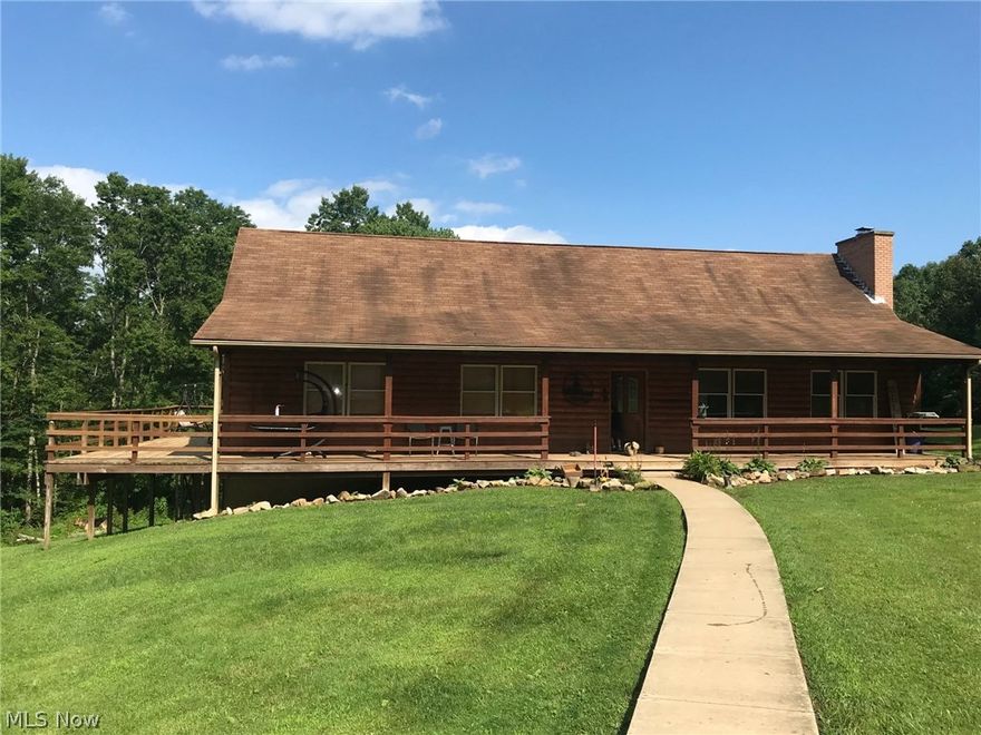 Nature lover's paradise. This beautiful log home built in 2003 offers an open floor plan with master suite with large closets and laundry area on the entry level. Upstairs boasts two additional bedrooms, full bath and open family room over looking the main floor. Enjoy the view from the full length front porch that wraps around to the large back deck overlooking the newly installed pond. A partial basement with walkout. The 2+ car garage allows for plenty of room to park and/or work on your next project. Additional storage buildings.