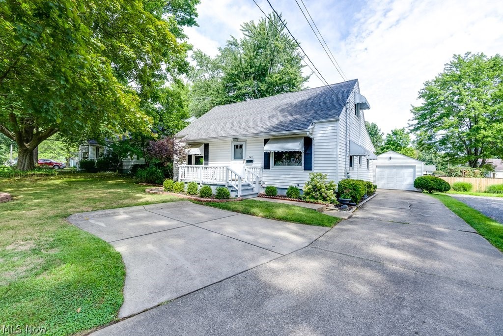 Well-maintained and move-in ready 4 bedroom/2+ Full bath Cape in the heart of Ravenna. So much larger than it appears from the outside! The main level includes two bedrooms (with hardwood floors under carpet), a full bath with tub, living room, and an open eat-in kitchen with a pass-through to the dining area that includes an island with additional seating and cabinet space. An enclosed porch has been converted to a fantastic family room for entertaining in the center of all the action! The first floor, stairway and upstairs hallway are repainted in neutral colors and the carpet was removed to unveil beautiful hardwood floors in the Living room. Upstairs are two additional bedrooms and another FULL bath with a newer shower stall (2021). A mini split system (2021) was added to the upstairs to provide additional cooling and supplemental heating, when needed. The fully waterproofed basement currently functions as additional living area, but could be used as an office, work-out room, studi