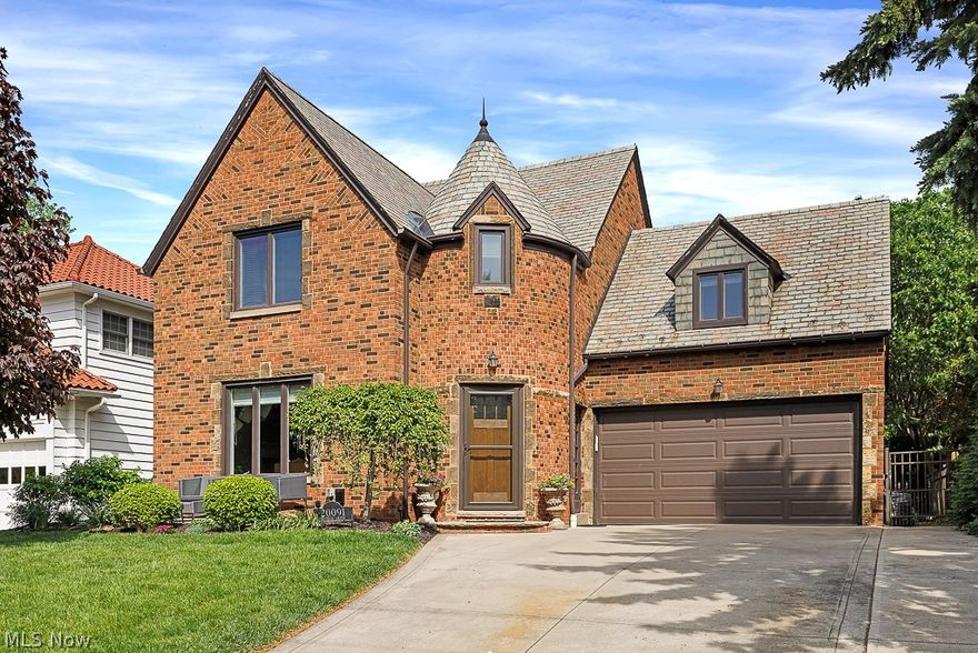 Charming Rocky River Beachcliff I home, that has it ALL, located on one of the most sought after streets. This remodeled home offers comfort, style, and convenience. 
The foyer leads into a spacious living area with a cozy fireplace and continues to an open floor concept that connects the living room to the dining area and kitchen, allowing for great entertainment. This large kitchen has been remodeled with custom built cabinets, granite countertops, high-end stainless steel appliances including a large island with an eat-in countertop, 2 ovens, a convection/microwave, and an additional high top eat-in counter, plus a wet bar with beer and wine fridge. The first floor powder room has also been remodeled with a marble countertop and tiled floors. The second floor master bedroom connects to a large walk-in closet with washer & dryer and ensuite bathroom renovated with spacious floor to ceiling tiled shower, large double vanities, heated floor and private toilet. The second floor has three additional bedrooms, one with another ensuite bathroom, perfect for a guest room, and a hallway bath for the additional rooms. The partial finished basement features another fireplace, temperature-controlled walk-in 700 bottle wine cellar along with a utility room including a second washer & dryer. The third floor is a large attic with lots of storage space and stair access. Outside, you'll find a beautifully landscaped front yard patio to sit and enjoy the view of the neighborhood.  Additionally, a backyard patio and fully fenced in yard for some privacy and relaxation. Located blocks from Rocky River Park and private beach access, as well as walking distance to schools, shopping, and dining in downtown River. Don't miss out on the opportunity to make this your new home!