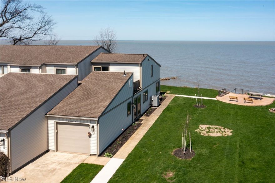 Positioned just steps from the shoreline of Lake Erie, this fully furnished, beautifully updated end unit condo offers unobstructed, panoramic water views and beach privilegesdelivering an exceptional waterfront lifestyle. Expansive windows throughout capture breathtaking lake views from nearly every angle, filling the space with natural light and creating a seamless connection to the water.

The open-concept kitchen is thoughtfully appointed with granite countertops and a stainless steel appliance package, flowing effortlessly into the main living areaperfect for refined entertaining or relaxed lakeside living. A convenient first-floor half bath adds functionality, while the lofted second level provides access to a private balcony area. A remote-controlled window covering enhances the dramatic upper window for added comfort and convenience.

Thoughtfully updated over recent years, with the most recent enhancements including the replacement of all doorsfeaturing two newer sets of sliding glass doors and a garage door with updated components. The attached fire-rated garage has been recently improved and offers exceptional versatility, easily functioning as usable entertaining space. It also includes a pull-down attic with newer flooring, providing additional storage.

Immediate possession is available, offering the opportunity to enjoy the full summer season without delay. Ideally located just minutes from marinas, Cedar Point, Sports Force Parks, Route 2, shopping, dining, and local wineries, this property presents a rare opportunity to own a turnkey waterfront retreat or full-time residence in a highly sought-after location.