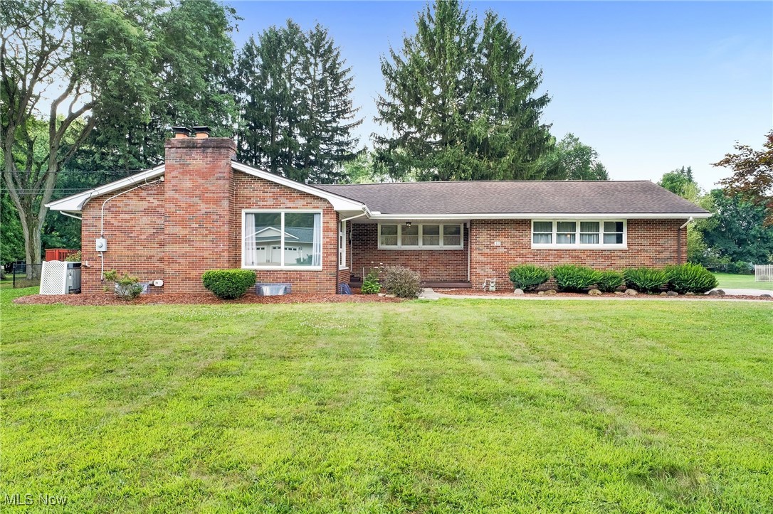 Welcome to 42 Orrlawn, a spacious brick ranch home set on over an acre of land in Tallmadge! The large concrete driveway offers ample parking and leads to a perfectly sized 2-car garage, ideal for protecting your vehicles from Ohio's weather. From the garage, you can access the covered front porch or head directly into the basement. This home features three generously sized bedrooms and the convenience of one-floor living. The centrally located master bedroom includes its own en suite bath. The expansive living area provides plenty of space for your ideal furniture layout as well as a beautiful stone fireplace which can be wood or gas and is wonderful for those cold winter nights. The dining area feature brand-new LVT flooring and new carpet in the living room and bedrooms.. The kitchen is equipped with new appliances, stunning granite countertops, and a spacious pantry, perfect for preparing your favorite meals. Downstairs, the basement adds an additional 543 square feet of living space, complete with new carpet and glass block windows, ready to be transformed into a home theater, office, or cozy family hangout. The back room is great for storage or crafting, while the unfinished basement space offers even more options for storage. Step through the brand-new, glass sliding door onto a large deck, perfect for entertaining or enjoying a peaceful sunset. The deck includes a natural gas line hookup for the grill, which is already provided for your convenience! The large, fenced yard is ideal for your furry friend to roam freely. Additionally, the lot includes a storage shed and a spacious 12x24 outbuilding with its own garage door, ideal for parking a lawn mower, storing tools, or creating a workspace. Both buildings are ready for your ideal use! This property has so much to offer and is ready for you to call it home! For added peace of mind, the sellers are including a home warranty! Schedule your showing today!
