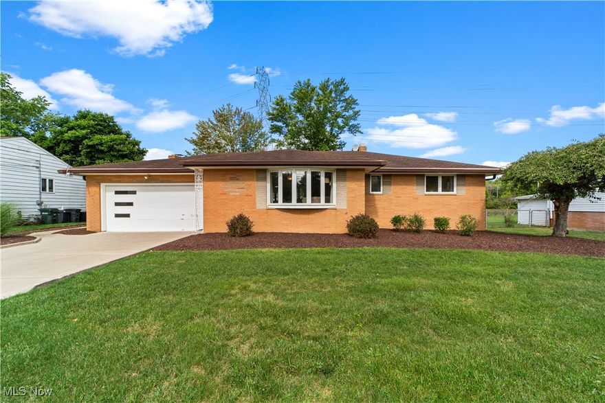 This updated brick ranch is ready for you to move in! It boasts a generous living and dining area with an open layout and gorgeous hardwood floors. The updated kitchen features granite countertops, including a large island perfect for casual dining and entertaining family and friends. The family room, featuring a fireplace for those cold Cleveland winters and a convenient half bath, opens to the backyard through a sliding glass door. Overlook the private backyard from your covered patio, helping you enjoy the warmer months in Northeast Ohio. 3 spacious bedrooms offer ample closet space. Recently remodeled bathroom featuring tiled shower, Jacuzzi tub, and his and hers sinks! The expansive basement includes a rec room ready for you to create the entertainment space of your dreams, a new man cave, or a beautiful playroom for the little ones. Plenty of storage throughout the home including in the basement and attic. Conveniently located with highway access, shopping nearby, minutes from the amazing Middleburg Hts Recreation center and pool, this home has it all. Call today to schedule your private tour.