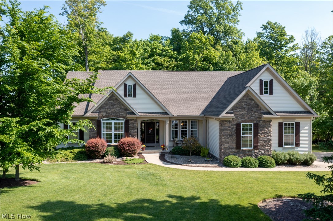 Stunning ranch-style home in a .76 acre corner lot in Westfield Center. Spacious, updated, open, bright & airy, and beautifully landscaped. A covered front porch welcomes you to this spectacular all-in-one floor home with 2416 Sq Ft of living space, character & charm. You will love the fantastic layout that flows throughout this three-bedroom home that features an open concept living formal dining room that leads to the great room and kitchen. The beautiful great room has a vaulted ceiling, engineered hardwood flooring, a lovely gas fireplace, and a wall of windows w abundant natural light & great views. An eat-in kitchen complete w stainless appliances, white cabinets, pantry, vaulted ceiling, breakfast bar accented by granite counters & beautiful tile backsplash, and a dinette area perfect for entertaining and holiday gatherings. A master bedroom w his/hers walk-in closet, and a master bath w double sinks, soaking tub & a tile/glass walk-in shower. The main floor is complete w an off