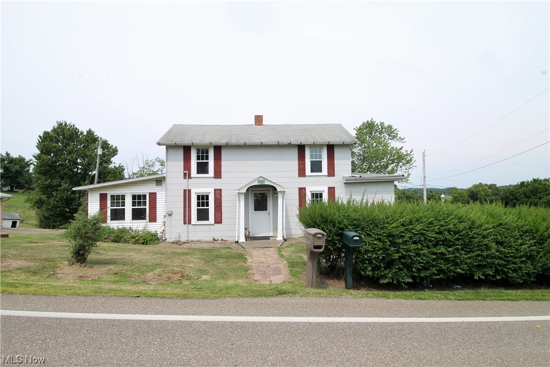 Welcome home to this gorgeous 9.66 acres of hunting property! Stream on the property. Close to the Farm Restaurant! New flooring throughout. First floor bedroom with built ins. First floor bathroom. Living room has built in shelves, fireplace, glass doors to the patio where you can sit out and enjoy the beautiful, tranquil scenery. Dining room. The large kitchen has plenty of cabinets, double sink, plenty of room to add an island, open to the bonus room, or playroom, etc. Upstairs there are two bedrooms. Two car detached garage. Shed. Barn with storage. New painted exterior. For land's sake! Come home to the quiet life!
