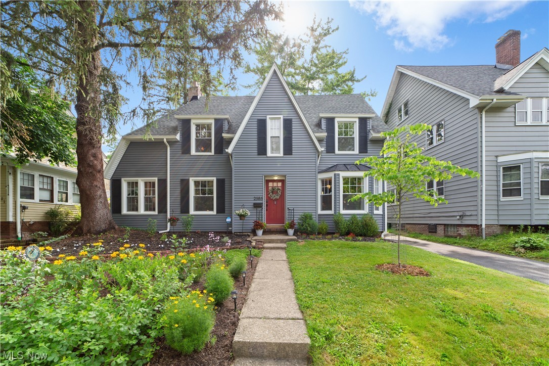 Welcome home to this beautifully maintained 3-bedroom, 2-bath colonial in the heart of Cleveland Heights! Boasting exceptional curb appeal with newer vinyl siding and gutters that have been upgraded with LeafFilter guards (2023), updated exterior doors, and refreshed landscaping, this home is as inviting outside as it is inside. The fully fenced backyard is a true retreat—featuring an attached deck, a pea gravel fire pit area, enhanced drainage solutions (2023), lush landscaping, and ample space for entertaining or relaxing. Inside, you'll be greeted by gleaming hardwood floors and a bright, open living room that sets the tone for the thoughtfully designed interior. Two versatile bonus rooms off the living area offer the perfect setup for a home office, playroom, or creative space. The dining room flows seamlessly into a stylishly updated kitchen complete with newer appliances, cabinetry, countertops, and a functional island sink—ideal for both everyday cooking and entertaining. A convenient rear hallway functions as a smart drop zone. Upstairs, you'll find a rare two-bathroom layout for the area, including a charming hallway with built-ins and a cozy window seat. One full bath is located at the top of the stairs, while the second is an en-suite off the primary bedroom. Two additional bedrooms complete the second floor. The basement offers even more versatility, equipped with a new furnace (2025), hot water tank, washer and dryer, sump pump with battery backup (2023), and full waterproofing—perfect for a workshop, home gym, or added storage. Other features include; newer windows, central a/c and coded exterior door locks, Ideally located within walking distance to Gigi’s on Fairmount, On the Rise Bakery, Shaker Lakes, and minutes from Cleveland Clinic and University Hospitals. This home is Cleveland Heights point of sale compliant and ready for its next chapter—don’t miss your chance!